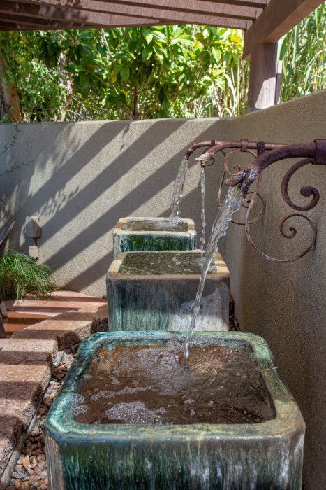 Water fountain under a pergola in a beautiful garden near Southwest Inn Sedona