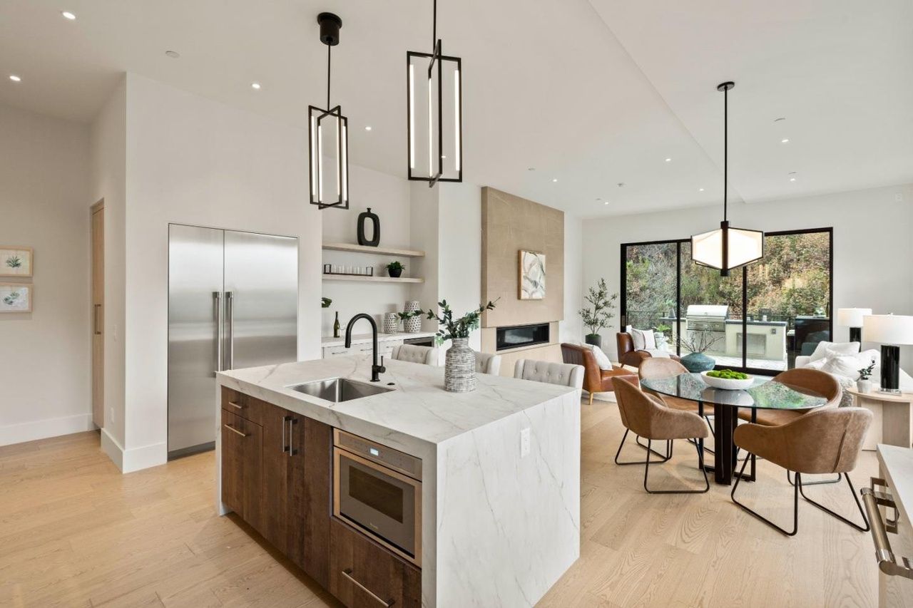 A kitchen with a large island in the middle of the room.