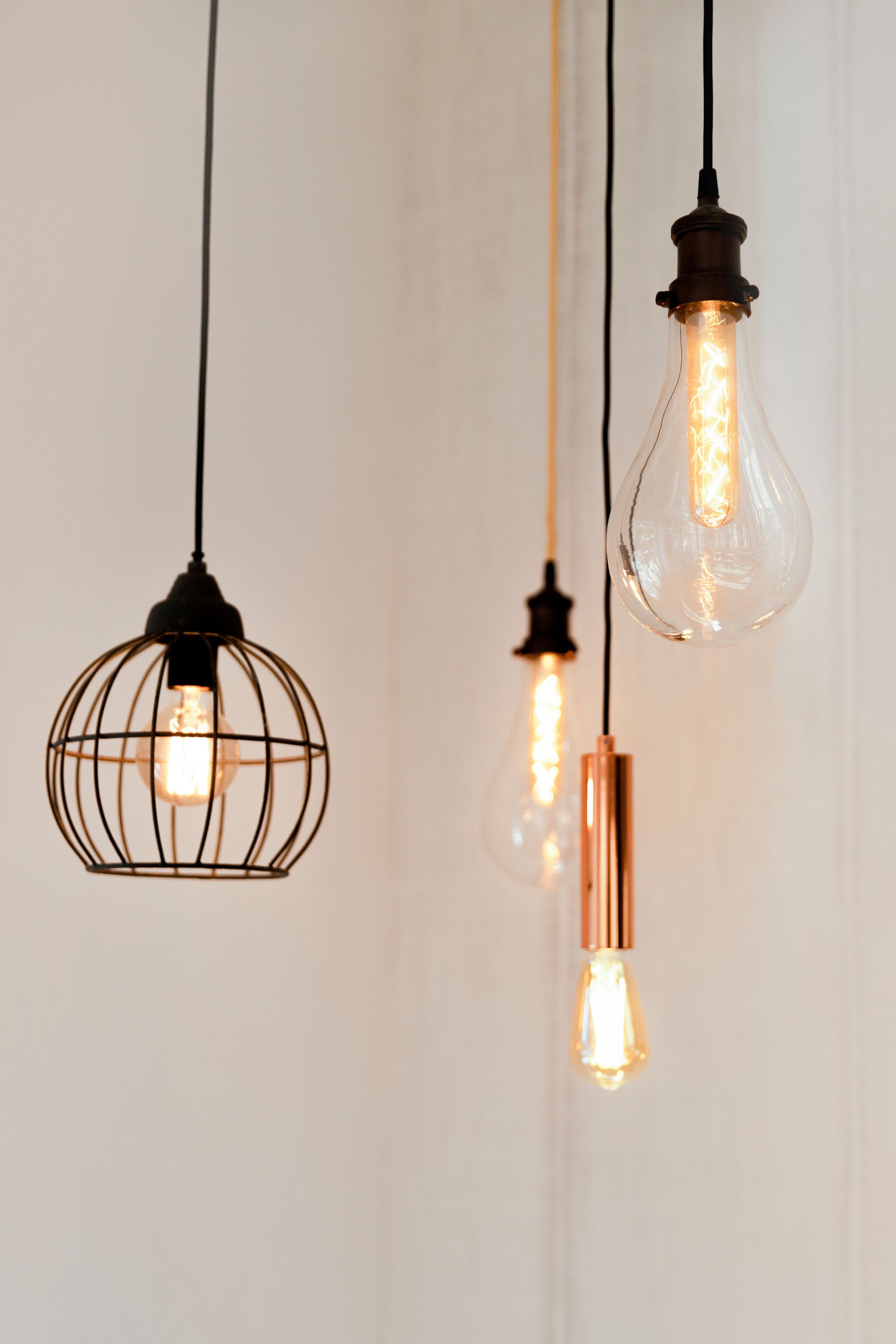 A group of light bulbs hanging from the ceiling.