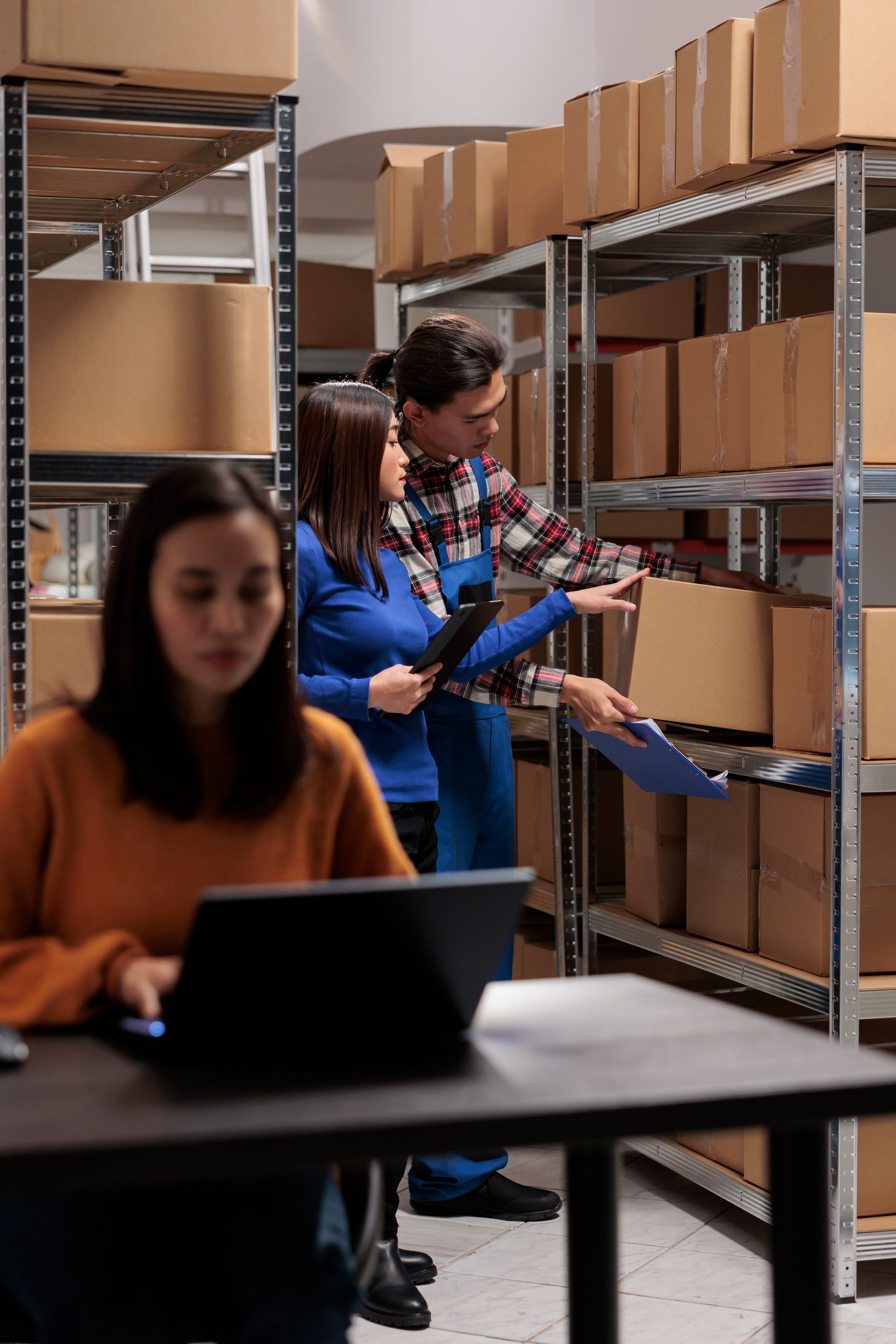 A group of people are working in a warehouse.