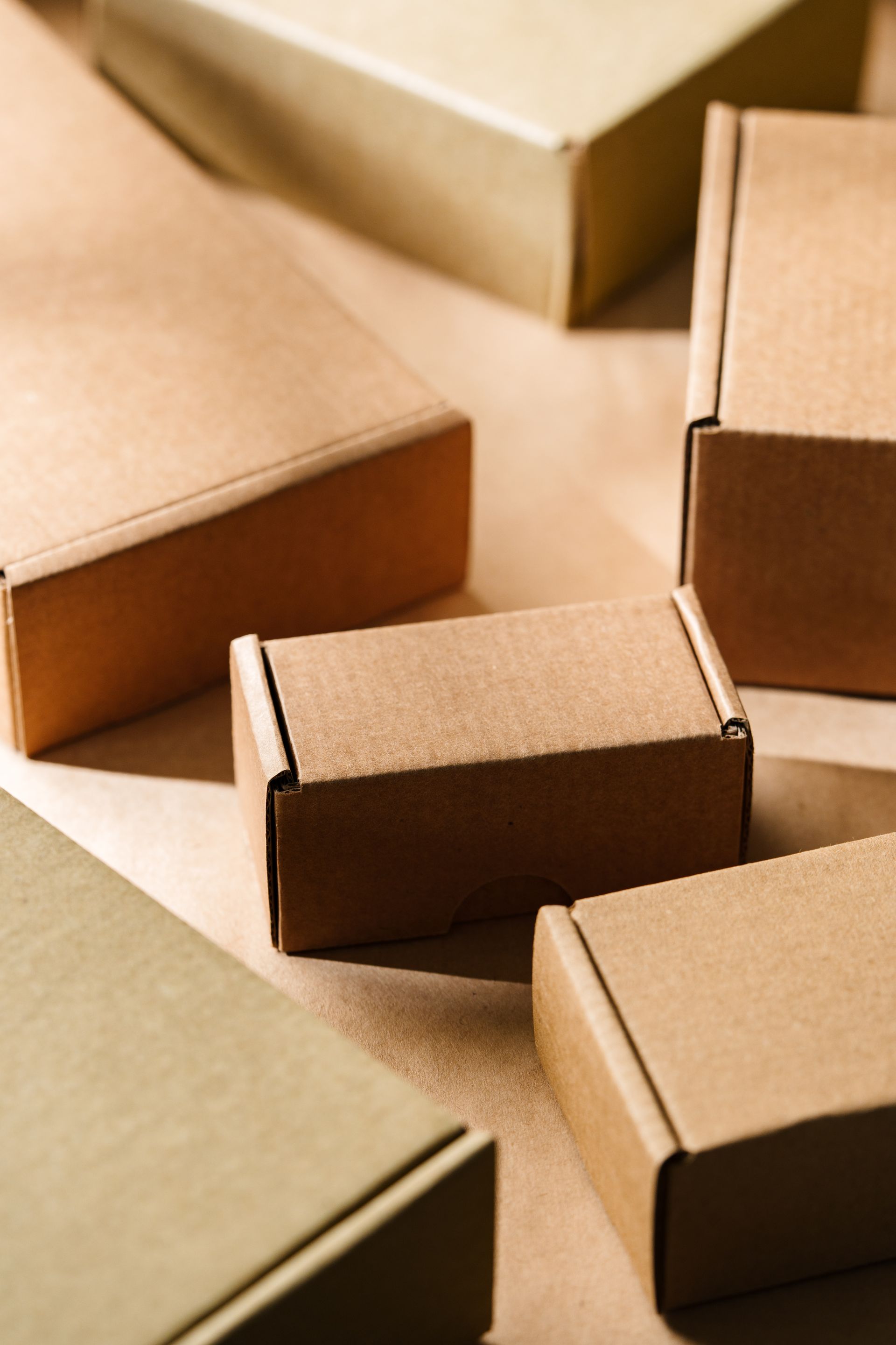 A group of cardboard boxes are sitting on top of each other on a table.