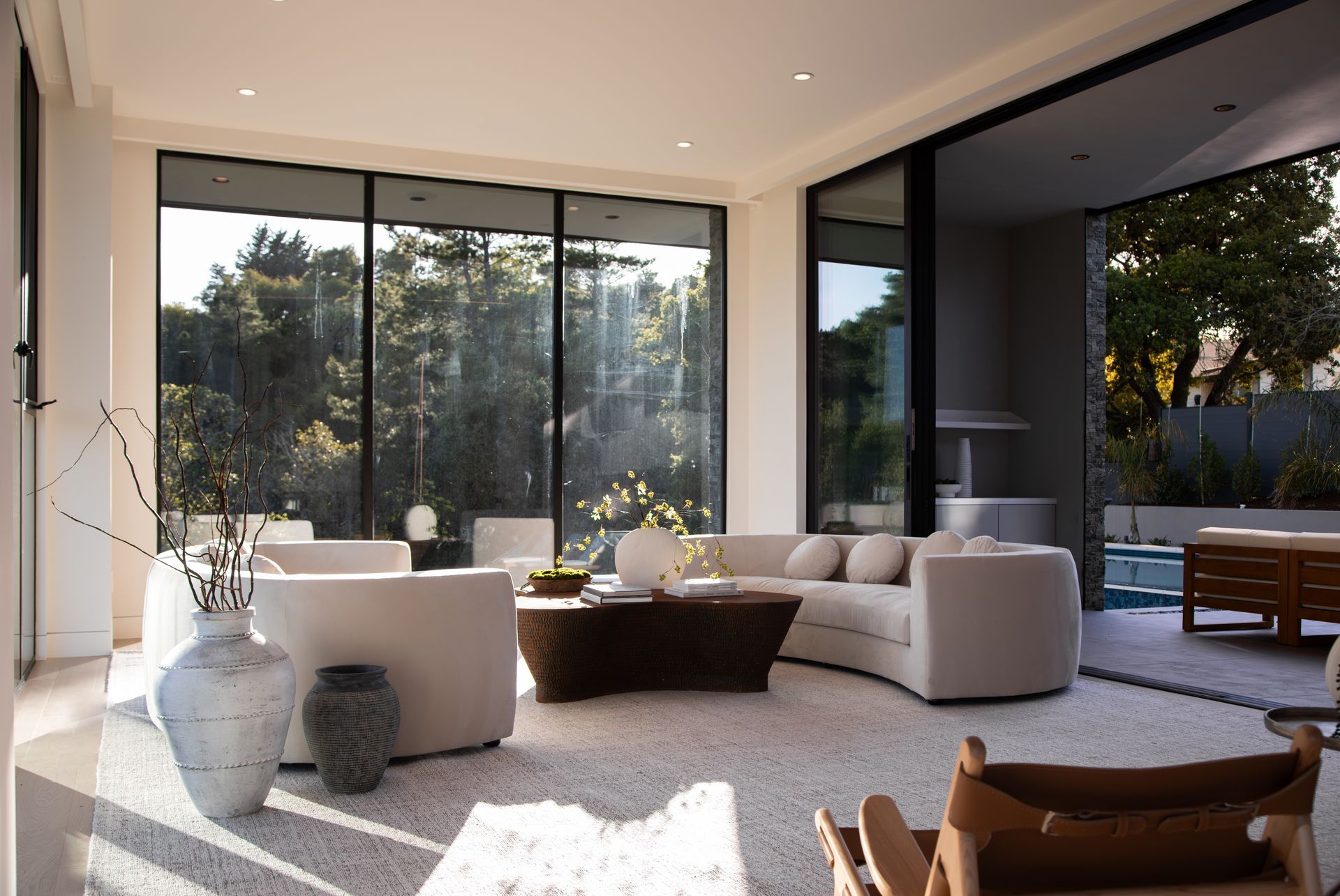 A living room with a couch and chairs and a table