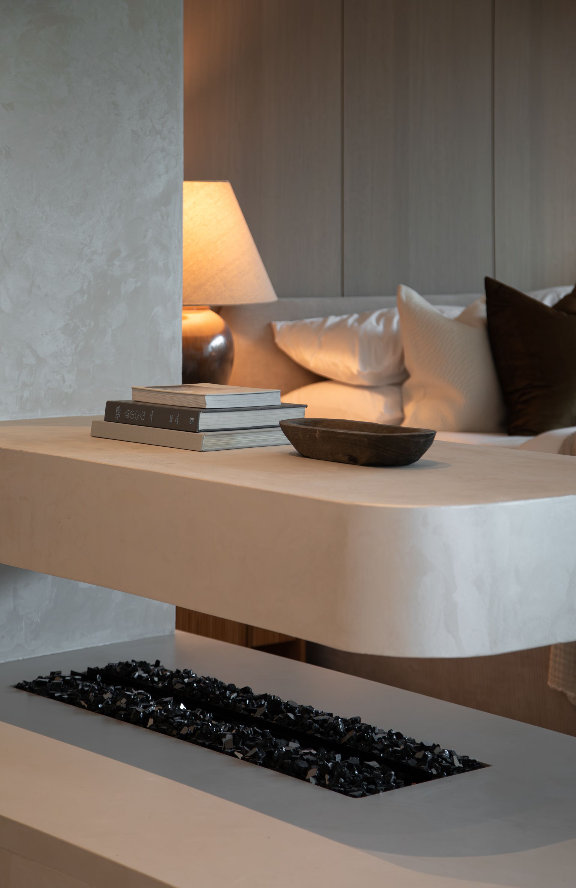 A living room with a fireplace and a couch.