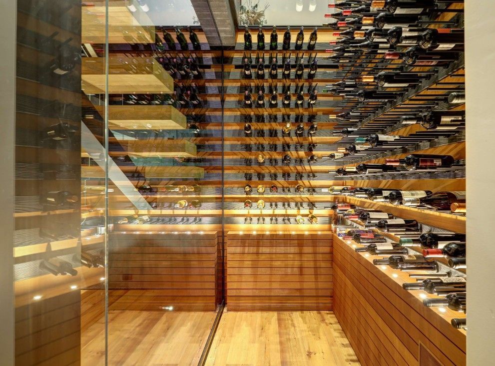 A wine cellar filled with lots of bottles of wine