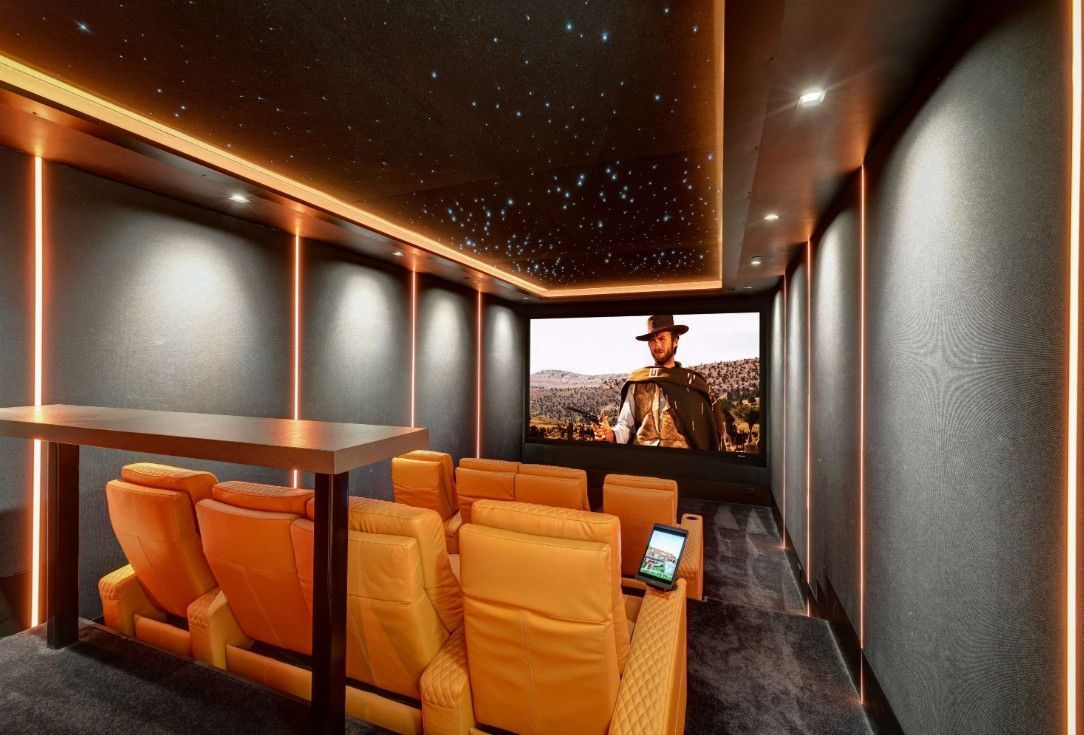 An artist 's impression of a home theater with a large screen