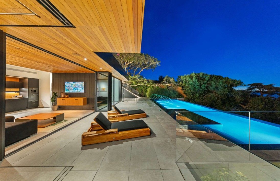 There is a swimming pool in the middle of the house.