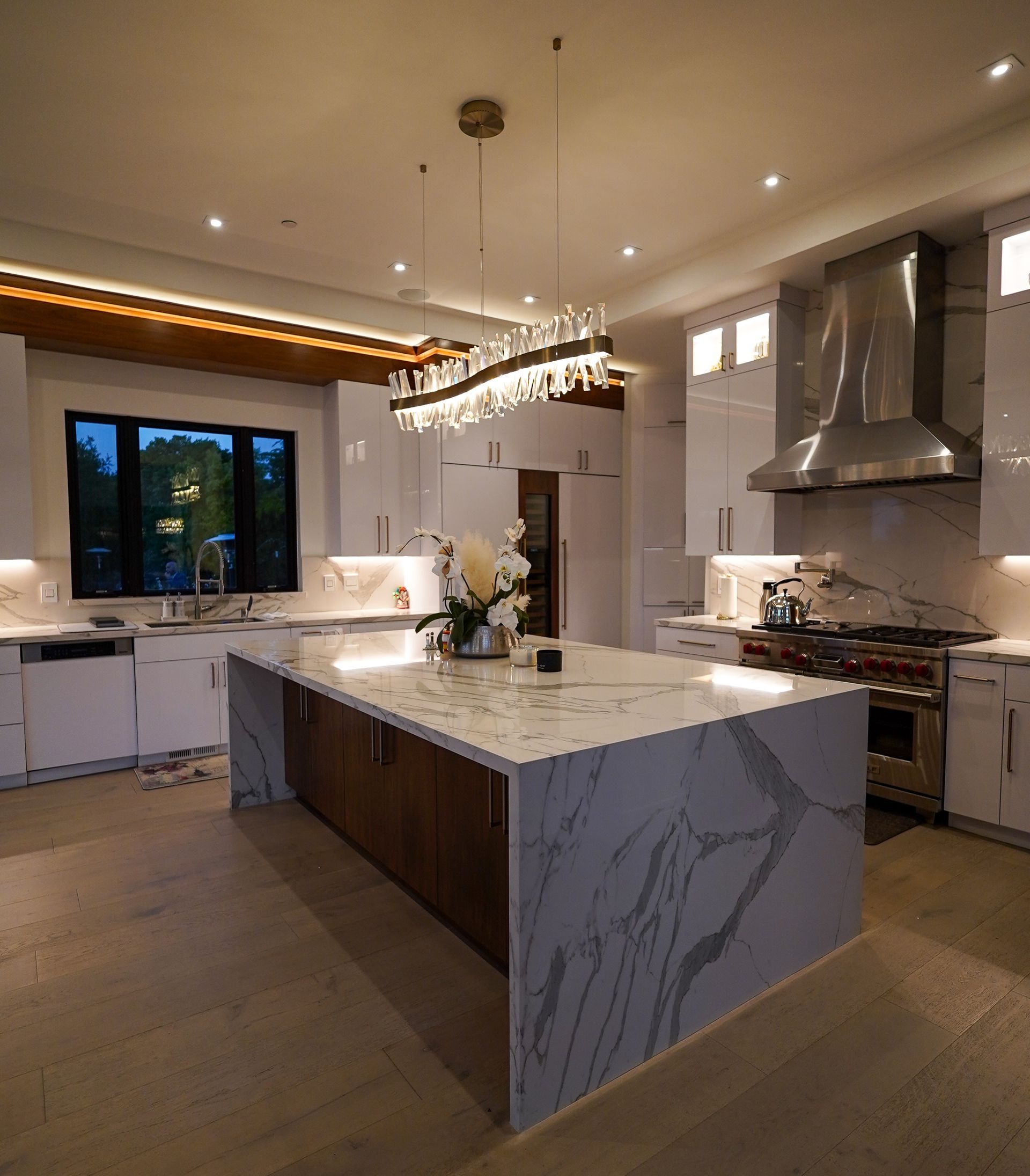 A large kitchen with a large island in the middle