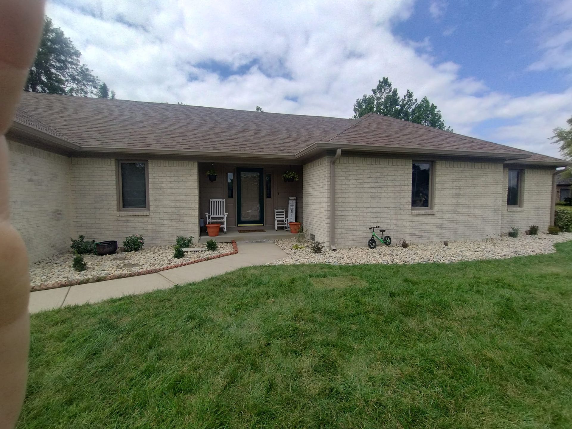 A house with two air conditioners on the side of it
