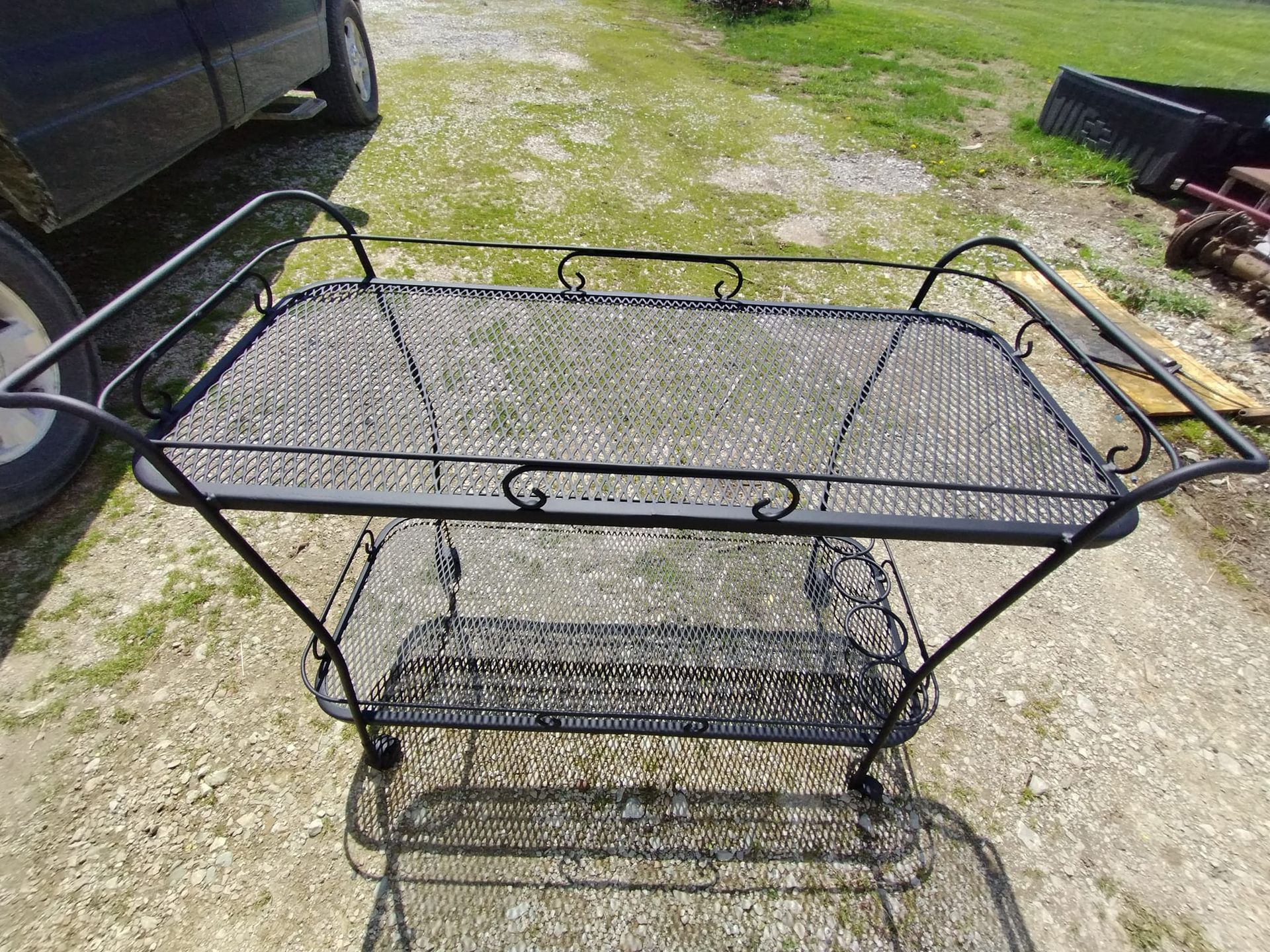 Kitchen with cream cabinets, stainless steel appliances, and two pendant lights hanging from the ceiling.