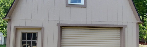 A garage with a roll up garage door and a window.