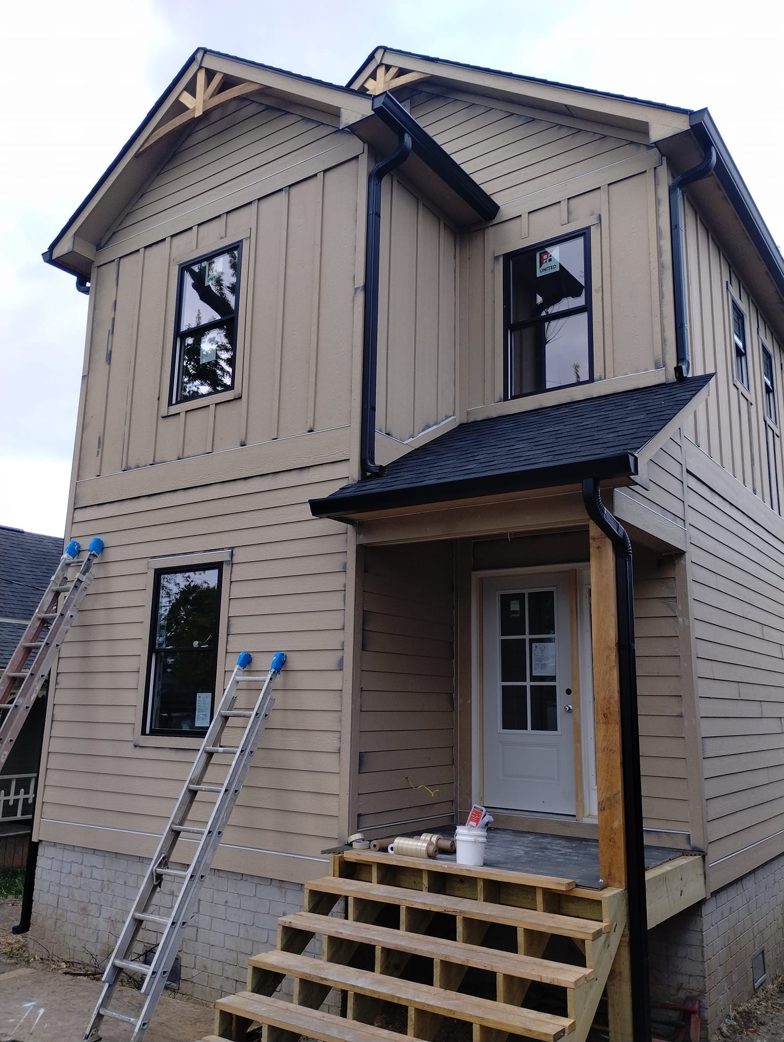 A house with a ladder on the side of it