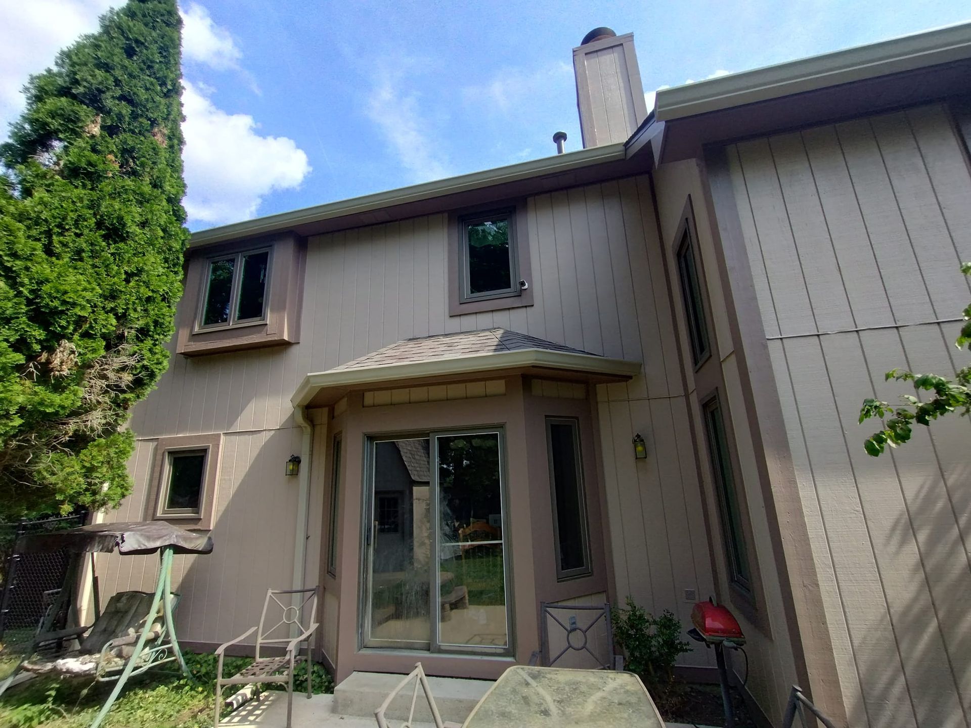 The back of a house with a sliding glass door