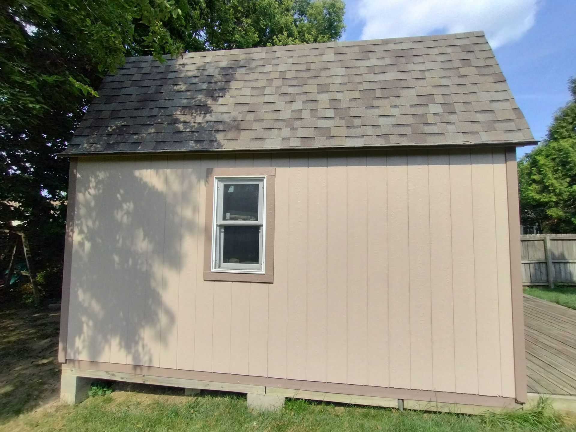 A small house with a roof and a window