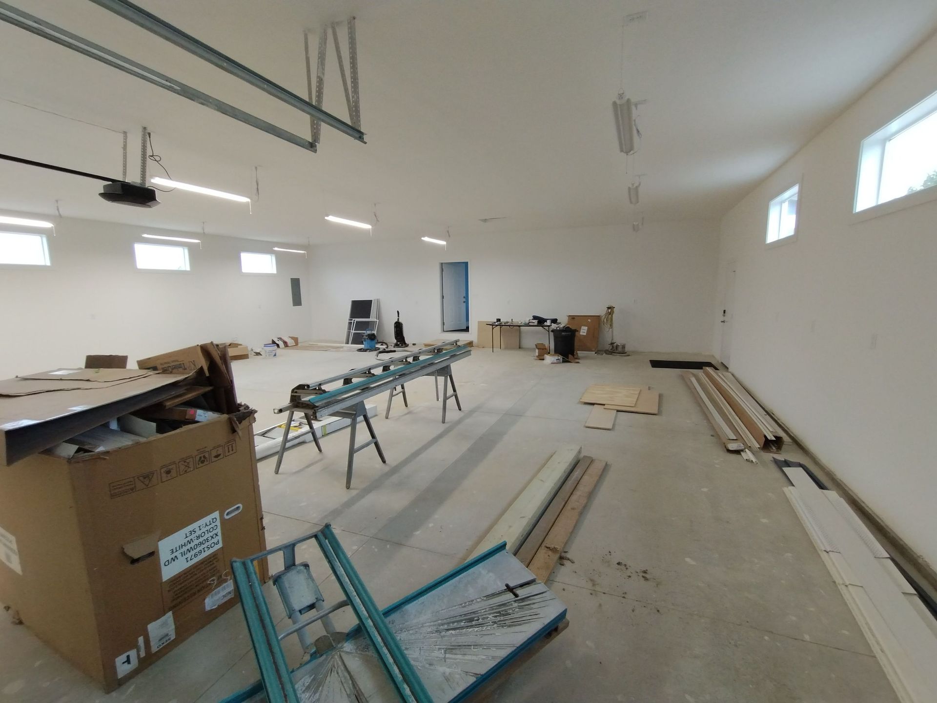 A large empty room with a box in the middle of it.