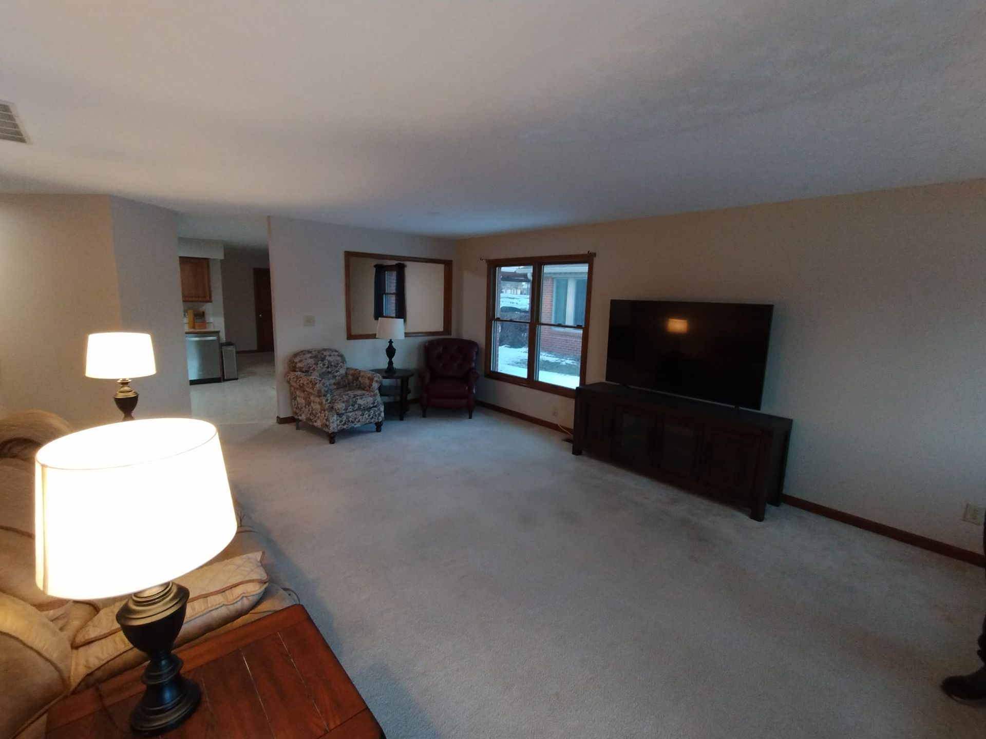 A living room filled with furniture and a flat screen tv