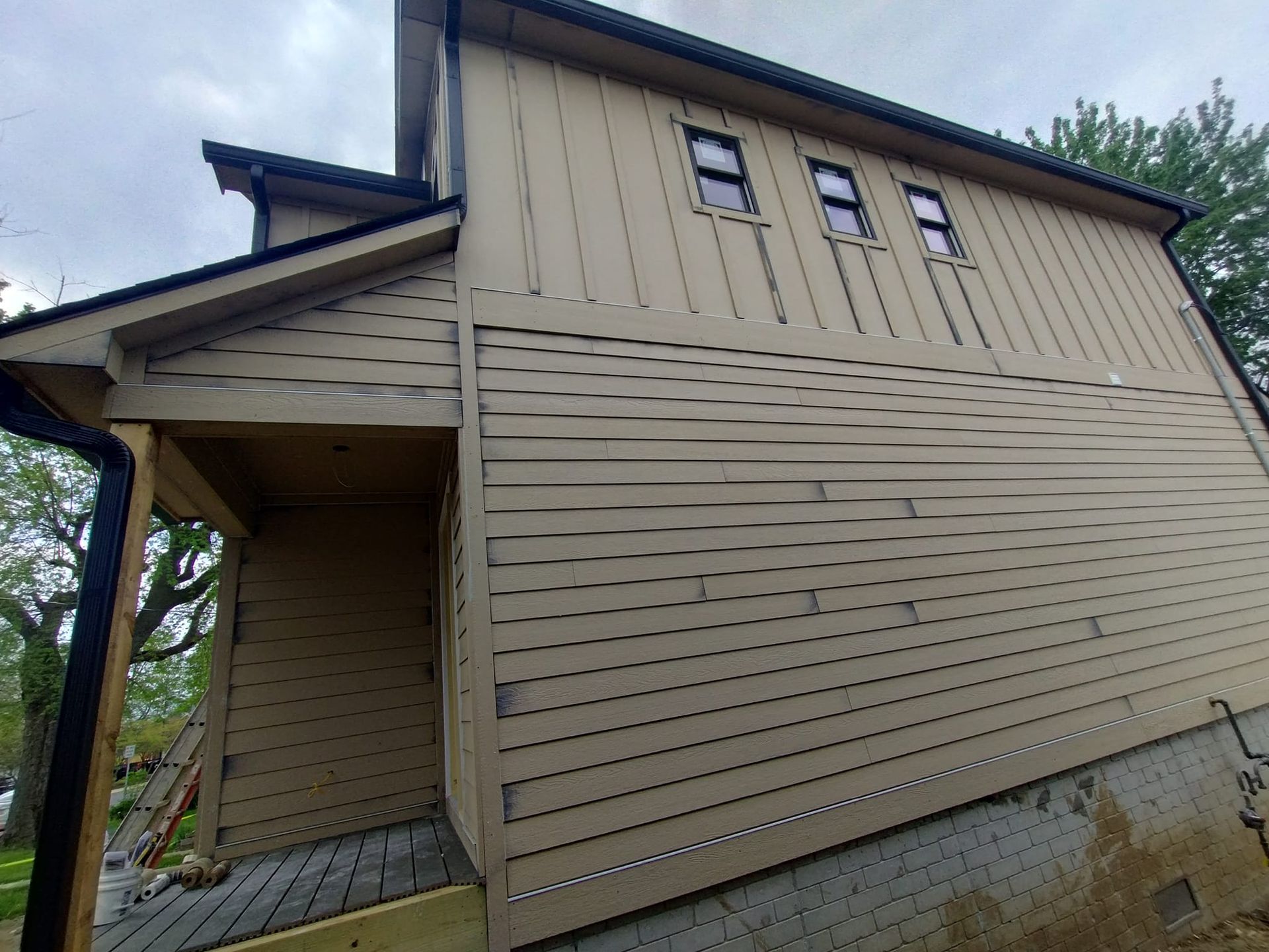A house with a lot of windows on the side of it.