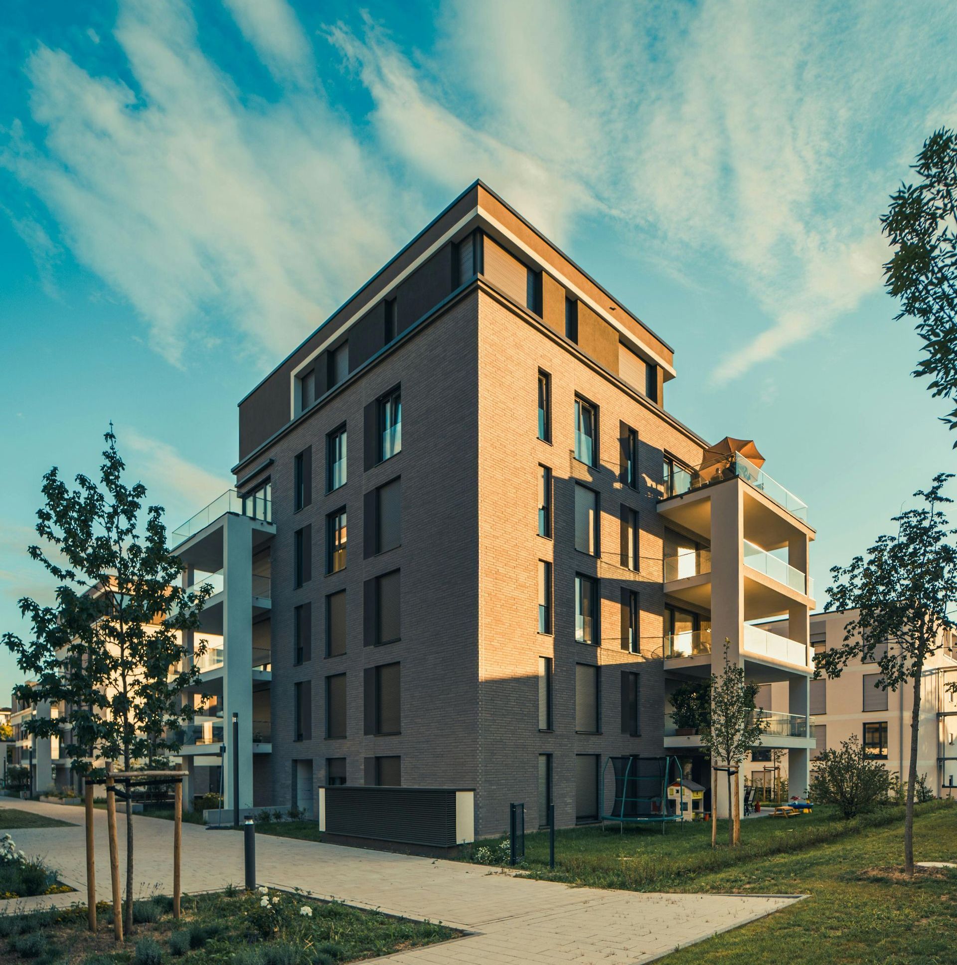A large brick building with a lot of windows and balconies