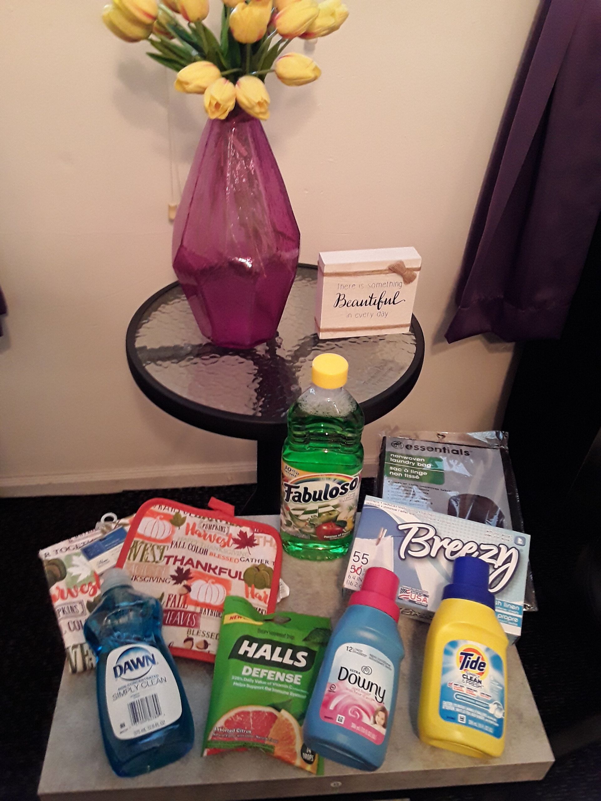 A collection of household essentials, primarily focusing on laundry and cleaning products.
