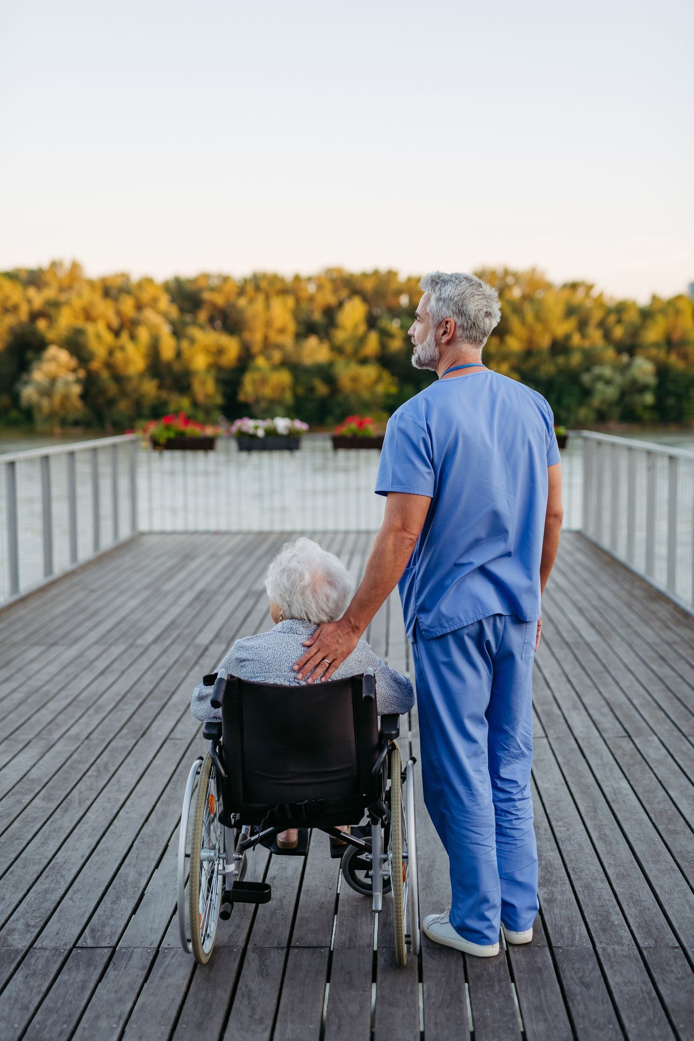 A nurse watching the river with the patient.
