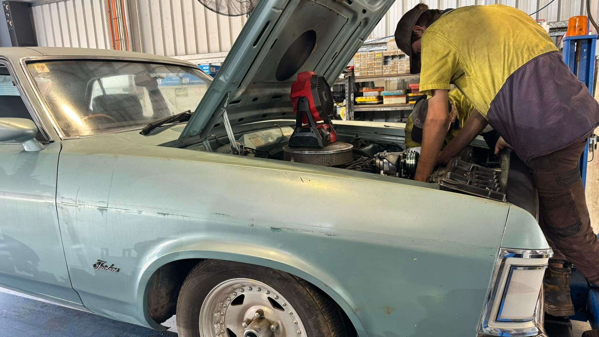 A Man is Working on a Car in a Garage With the Hood Open — All things Diesel NT in Tivendale, NT