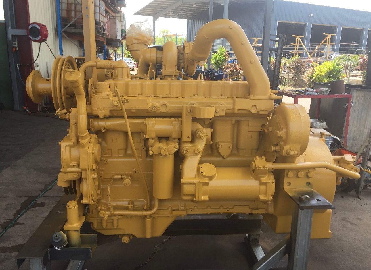 A Yellow engine is sitting in a workshop — All things Diesel NT in Tivendale, NT 