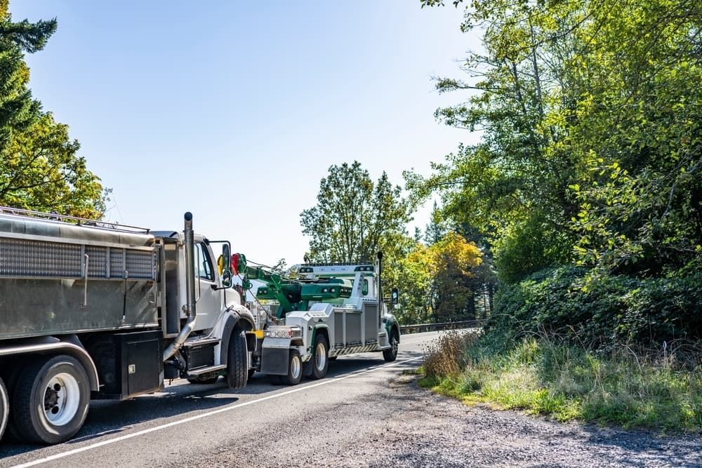 Two Dump Trucks Are Parked on the Side of the Road — All things Diesel NT in Tivendale, NT 