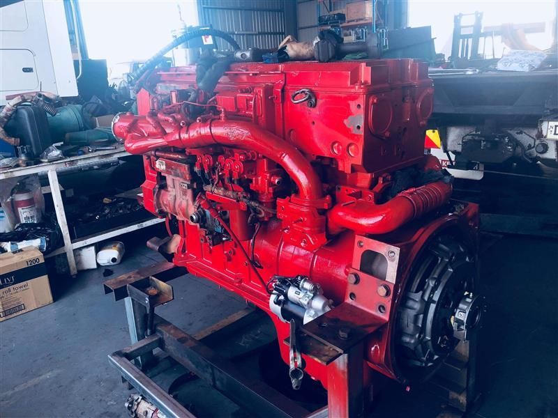 A large red engine in a work shed — All things Diesel NT in Tivendale, NT
