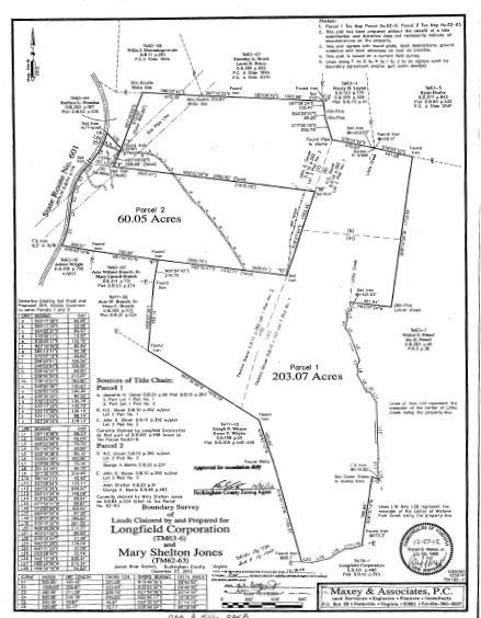 Land survey map showing two parcels, 69.35 acres and 203.47 acres, with property boundaries, measurements, and owner information.