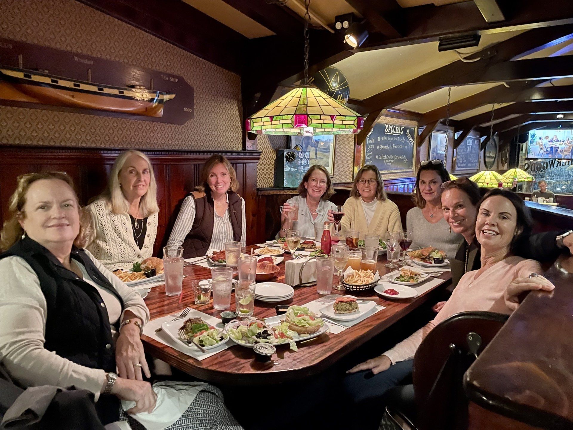 large party of women enjoying lunch at a table