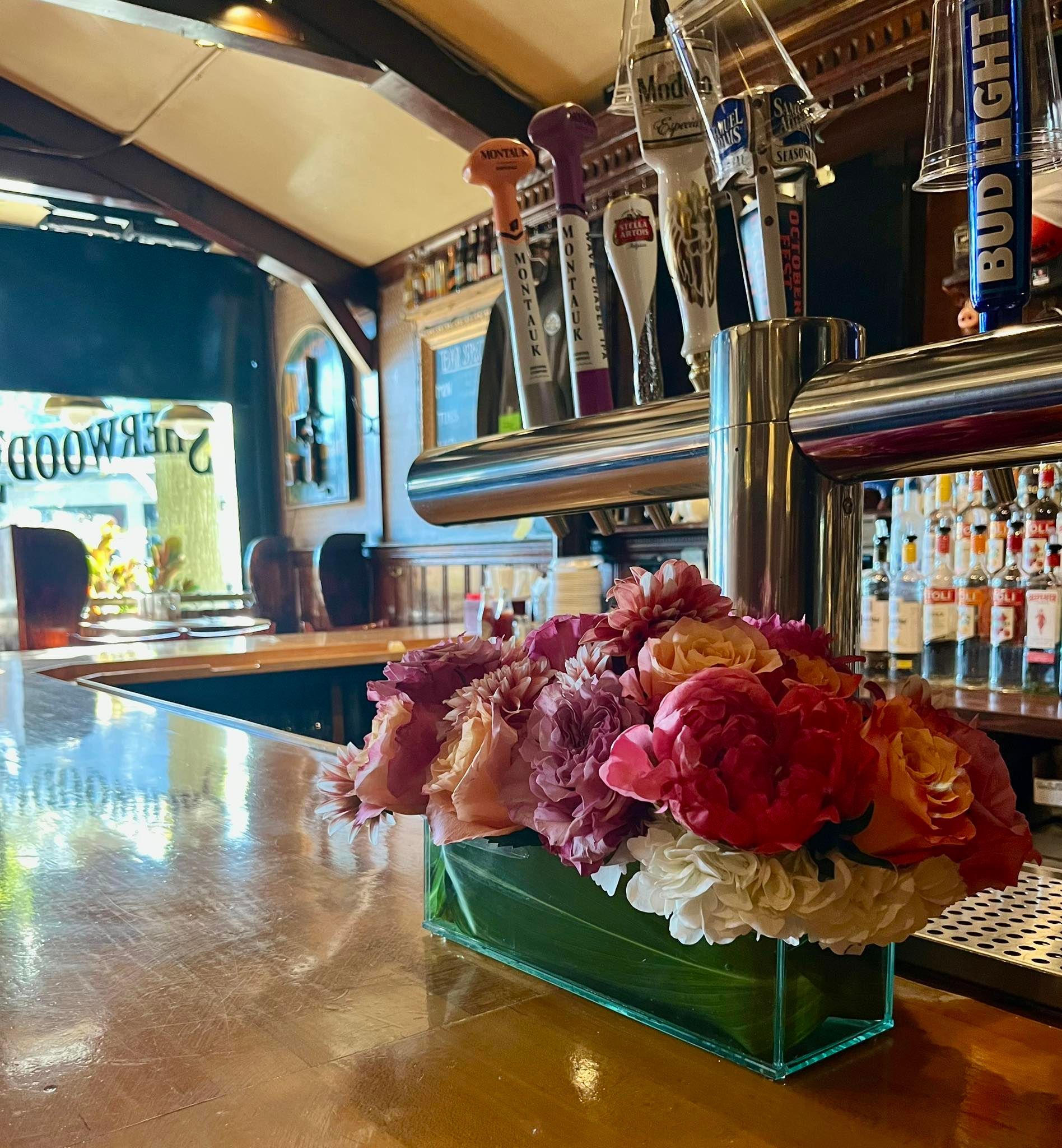 flower arrangement on the bar