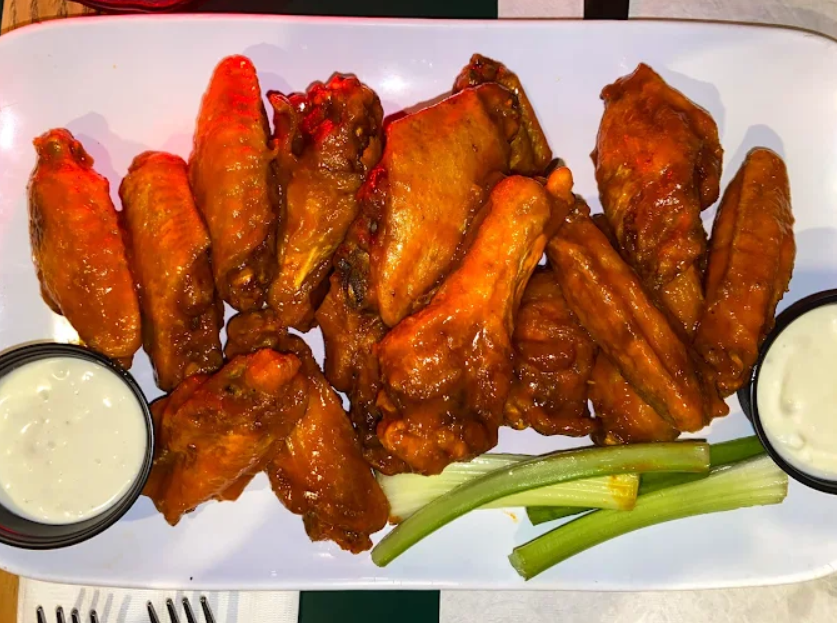 Buffalo chicken wings with celery and blue cheese