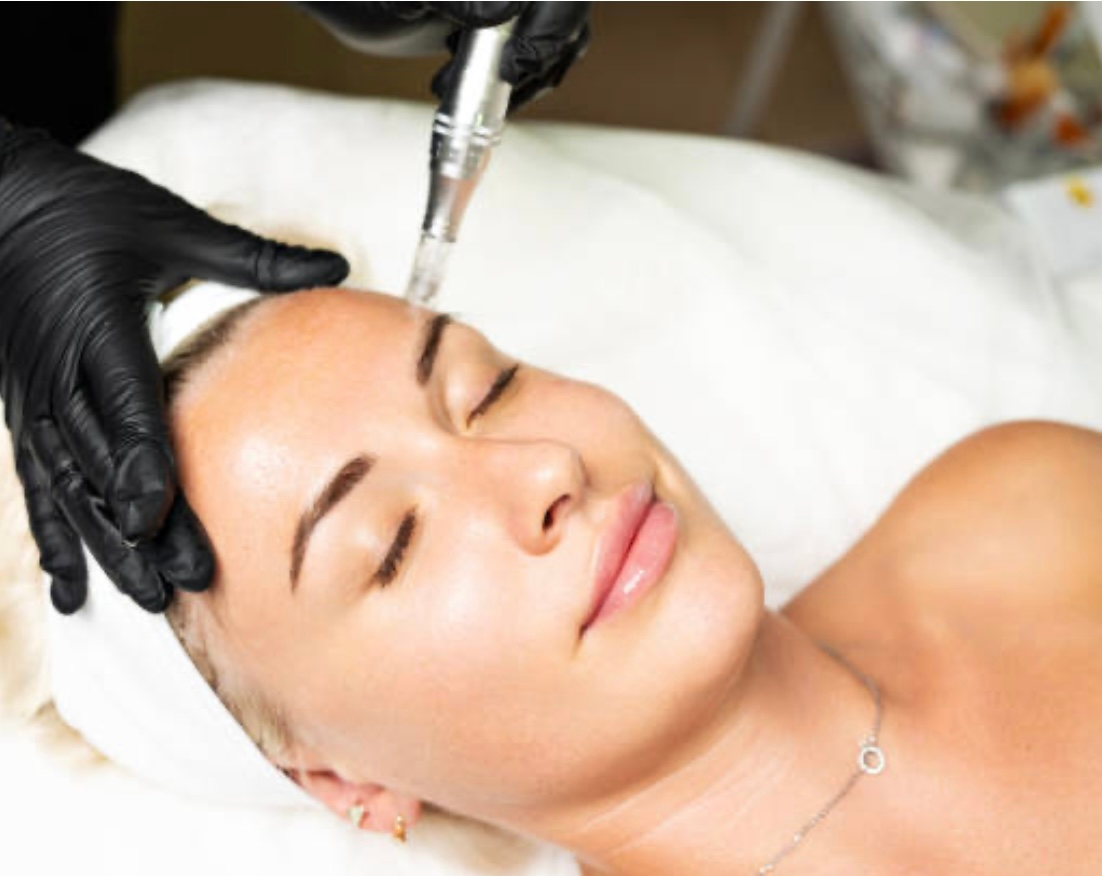 A woman is getting her legs waxed in a beauty salon.