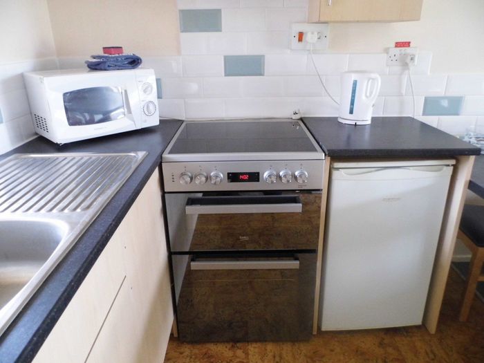 New stainless steel cooker in Albion cottage kitchen