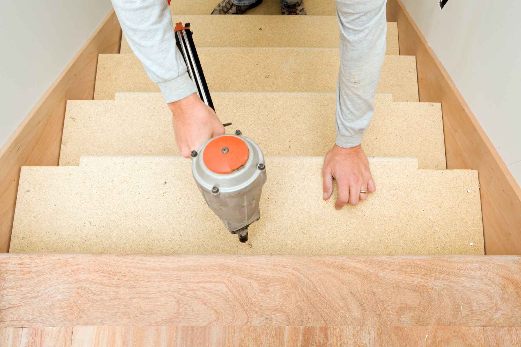 carpenter installing stairs