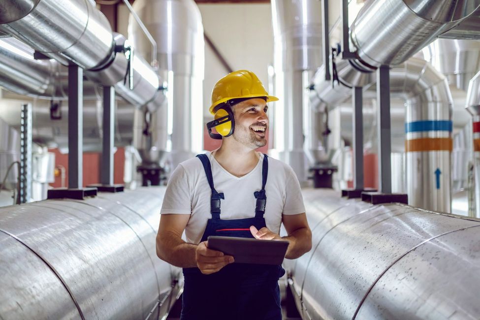 A group of people are standing in the middle of a canyon.