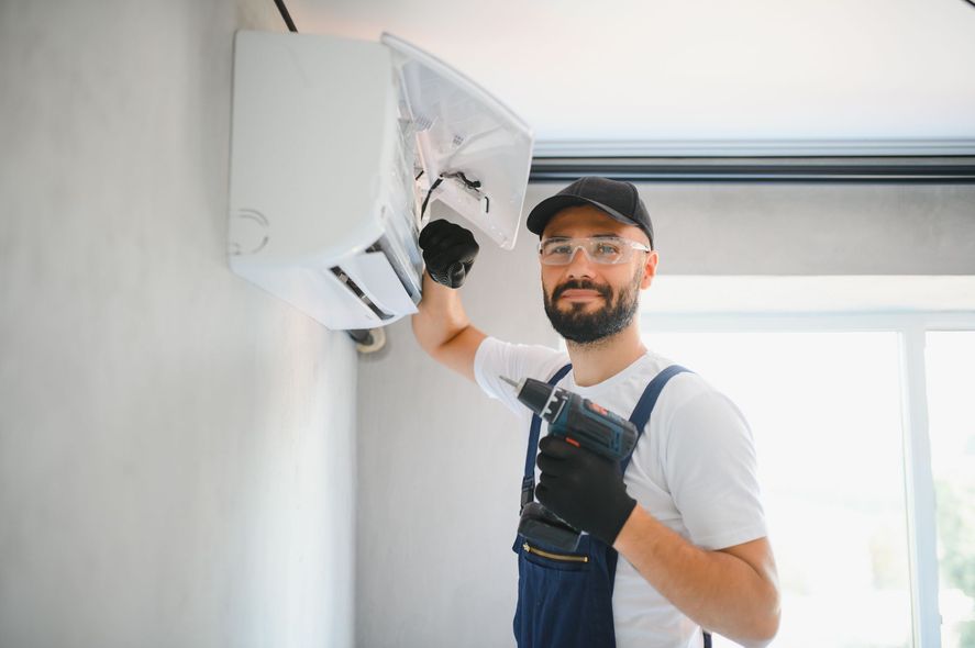 A river flowing through a valley surrounded by mountains and trees.
