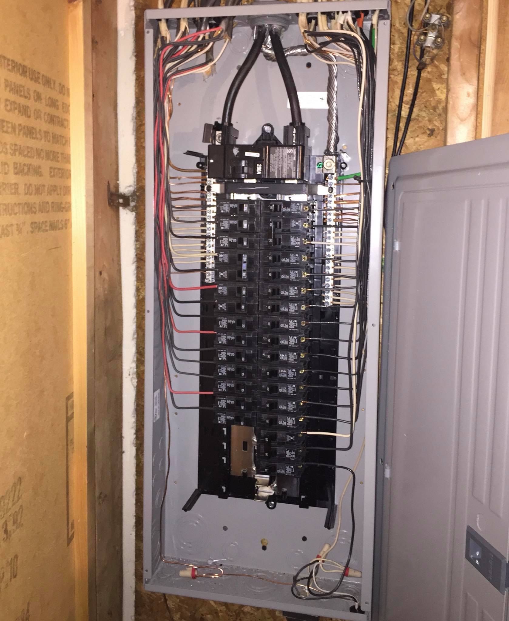 A close up of an electrical panel on a wall.