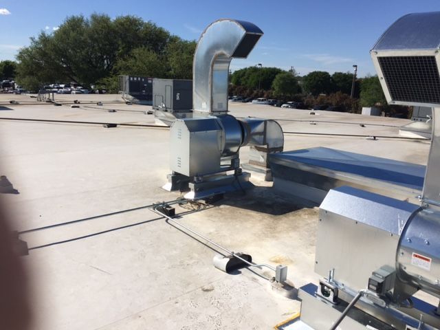 A roof with a lot of pipes on it