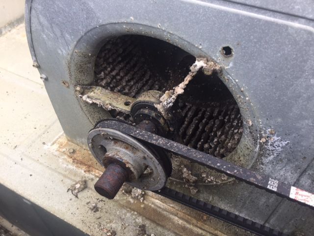 A close up of a machine with a belt on it.