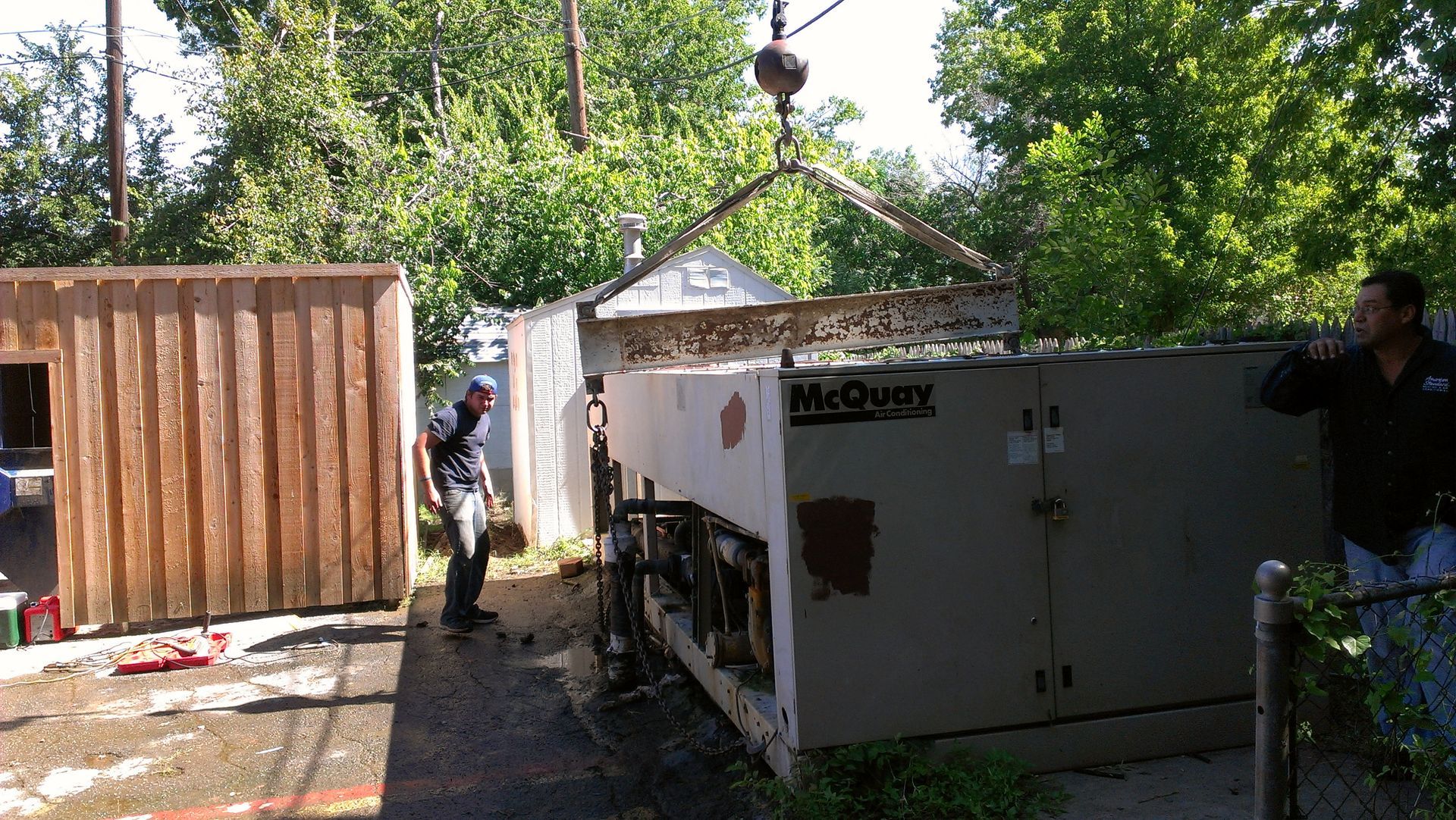 A mcgraw 's machine is being lifted by a crane