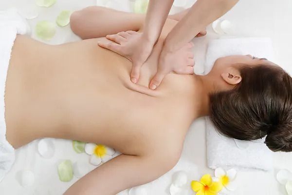 Woman laying facedown getting a massage 