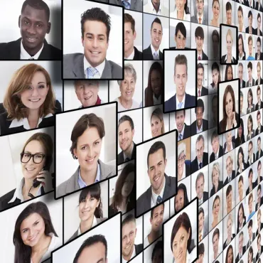 A collage of people 's faces on a wall