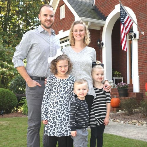 Former resident Jenny poses with her family.