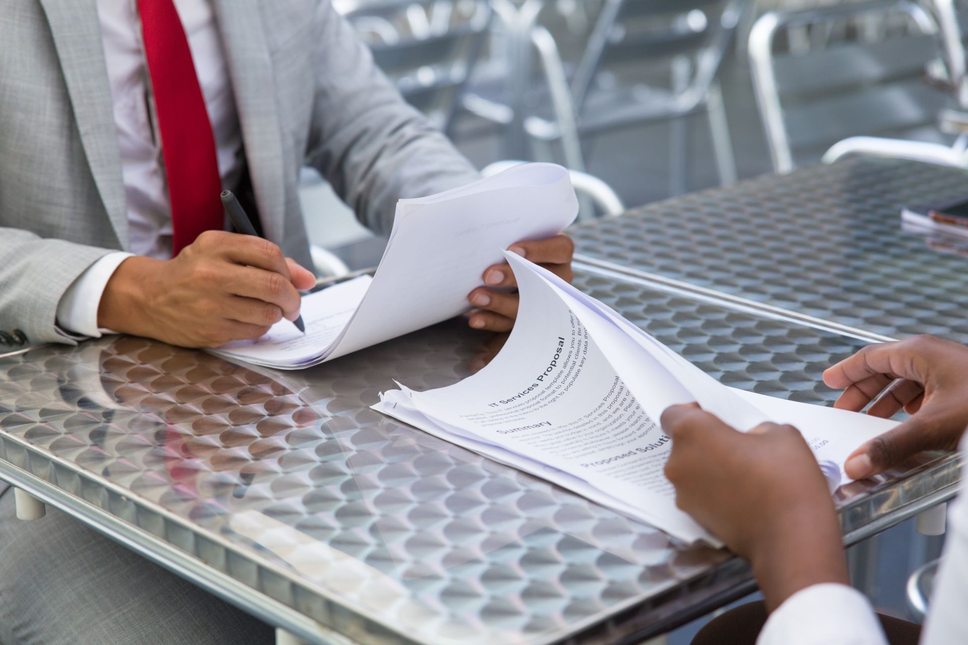 Men reviewing official paperwork.