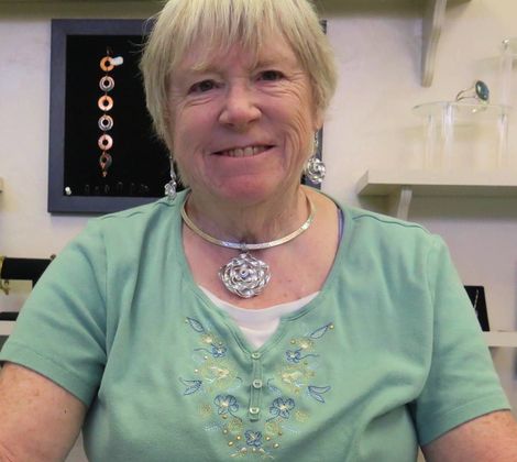 Nancy Klapak smiling in green shirt