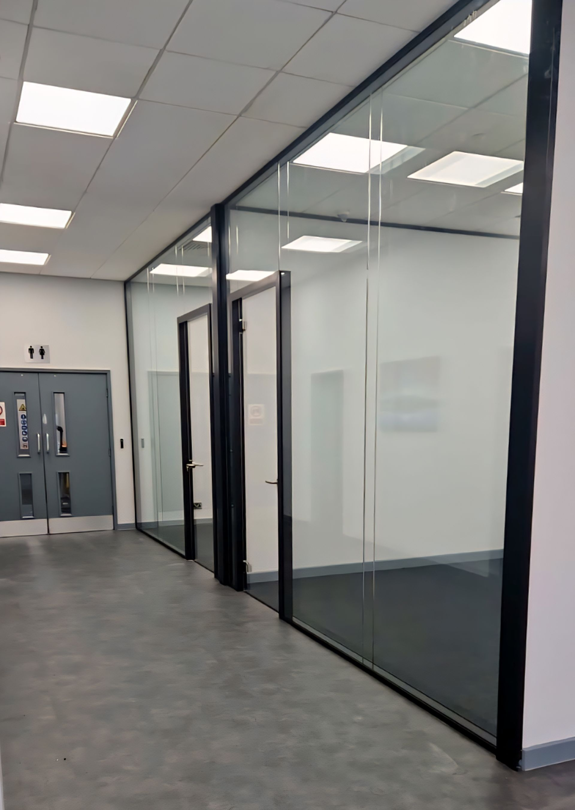 Double glazed office glass partition including glass door & glass overpanel installed in Sunderland