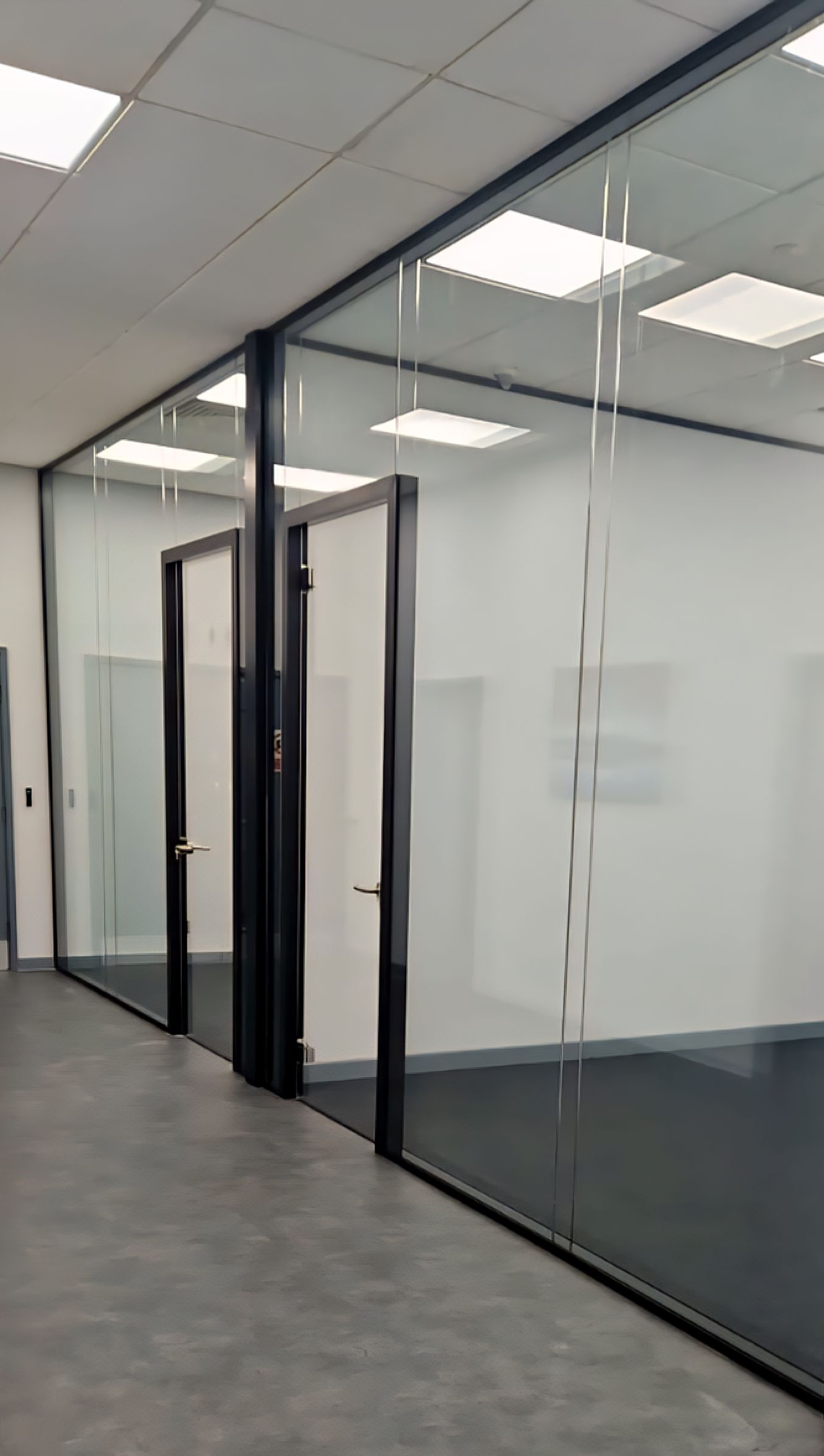 Double glazed glass partitions incorporating glass doors & glass overpanels in Sunderland by Clear Divide