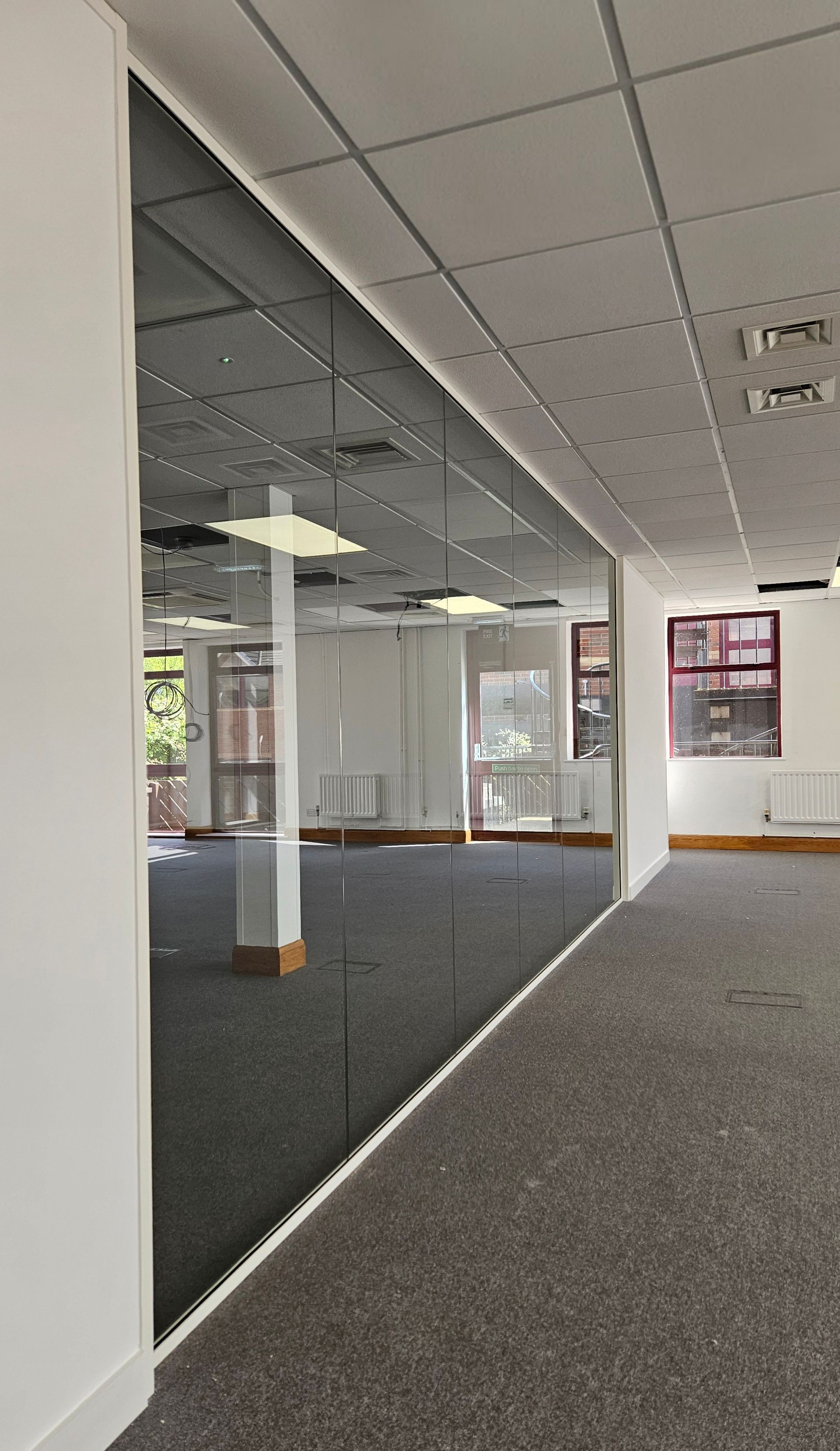 Frameless single glazed office glass partitions in Sunderland