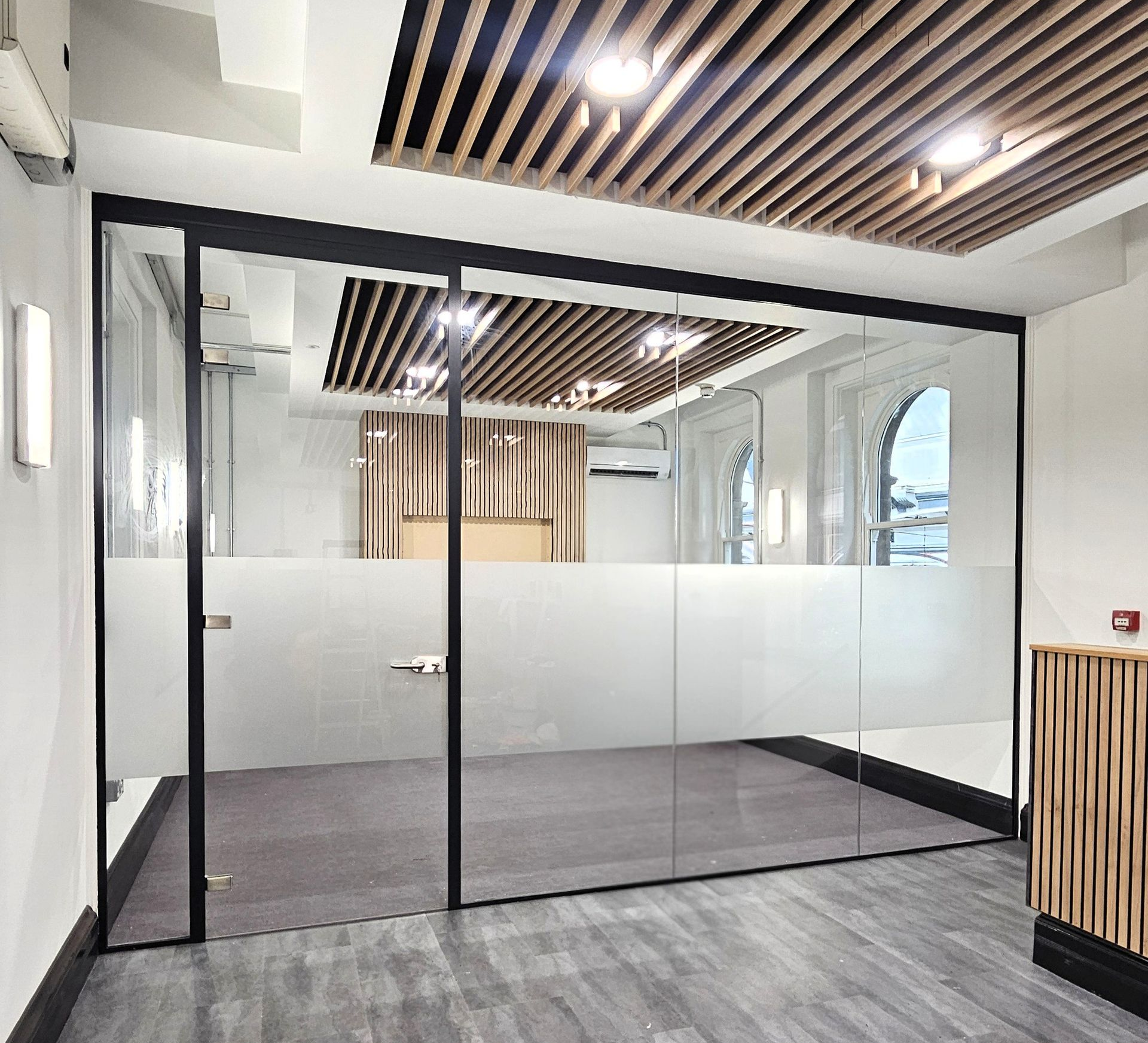 Single glazed office glass partition with slimline  door frame and glass door installed at Newcastle Central Station