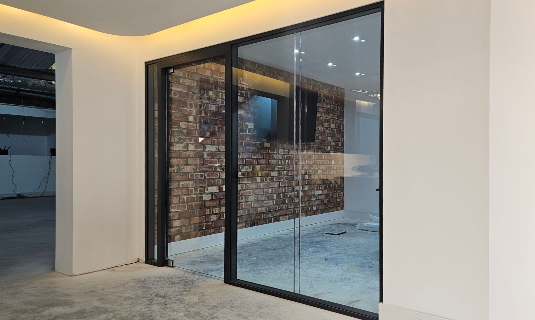 Double glazed office glass partition including glass door & glass overpanel installed in Sunderland